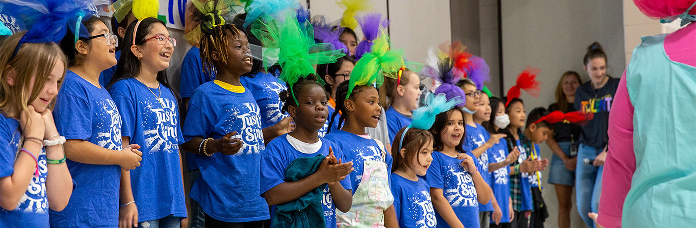 students singing on stage